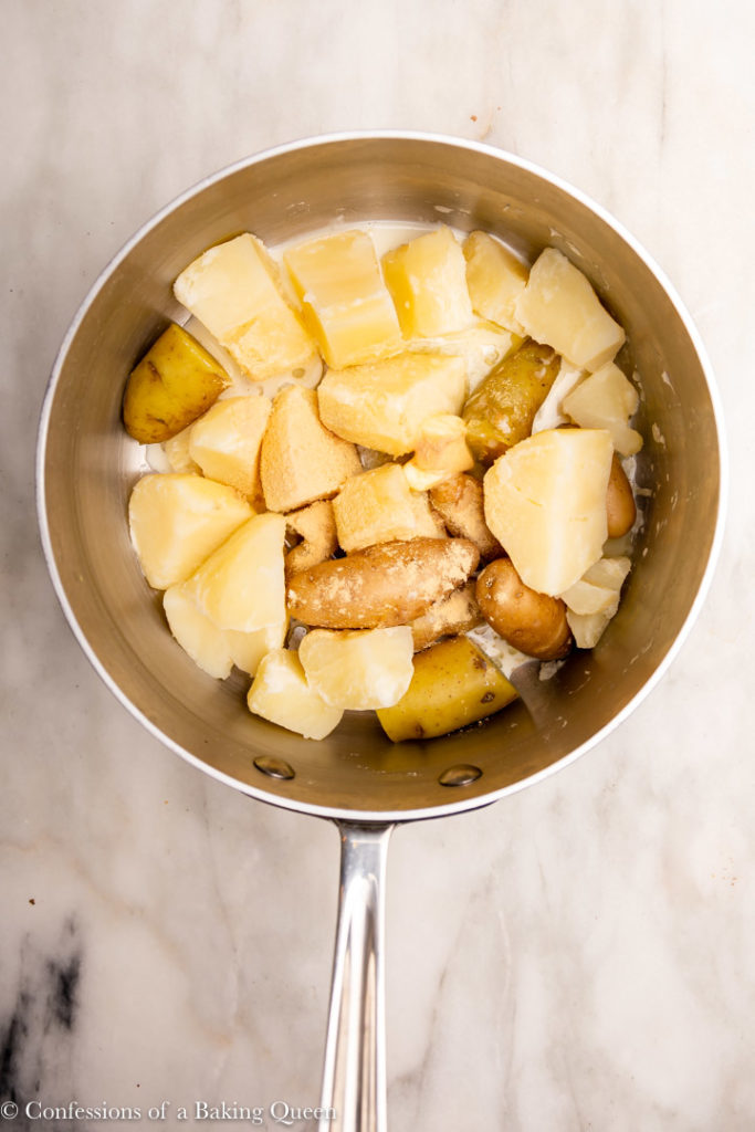 cooked potatoes with butter and crema in a large pot (1 of 1)