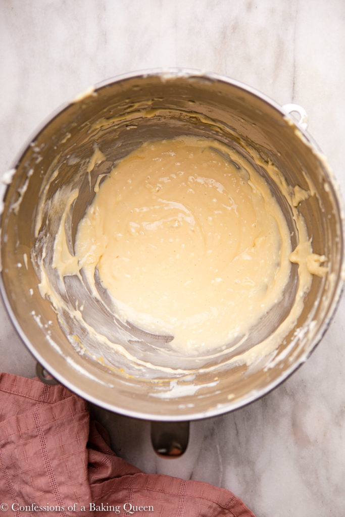 cheesecake batter in a metal mixing bowl 