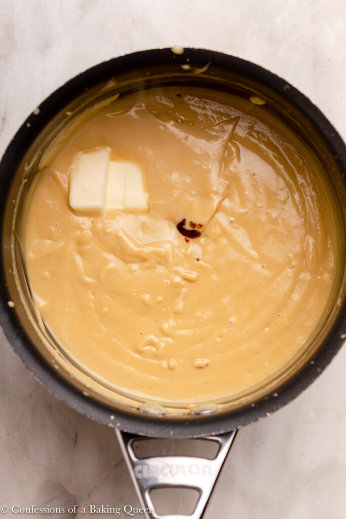 coffee pastry cream in a pot with butter and vanilla added