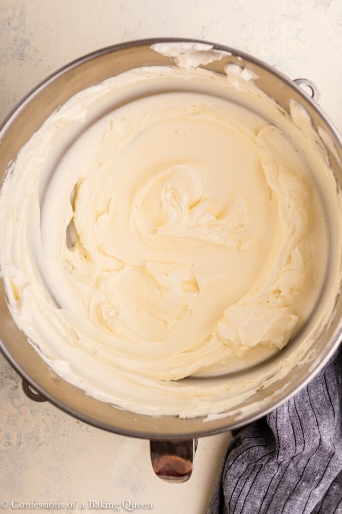 softened cream cheese mixed in a metal bowl