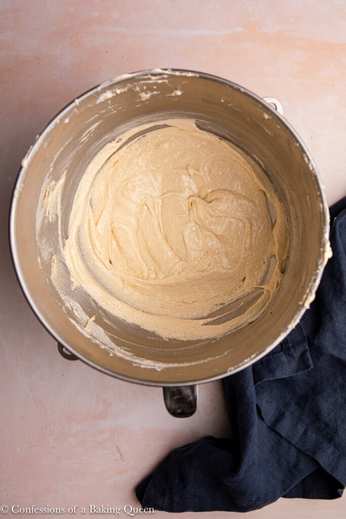 wet ingredient for coffee cake in a metal mixing bowl