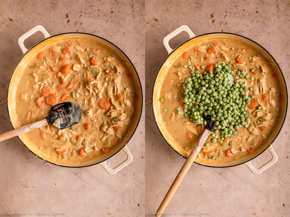 frozen peas added to chicken pie mixture in a large skillet with a wooden spatula on a light brown surface