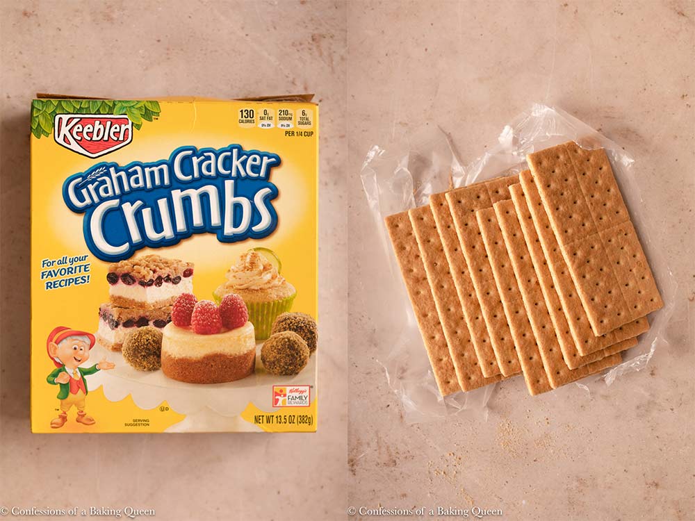 graham crackers and a box of graham cracker crumbs on a light brown surface