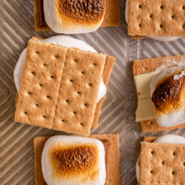 close up of smores on a metal cookie tray