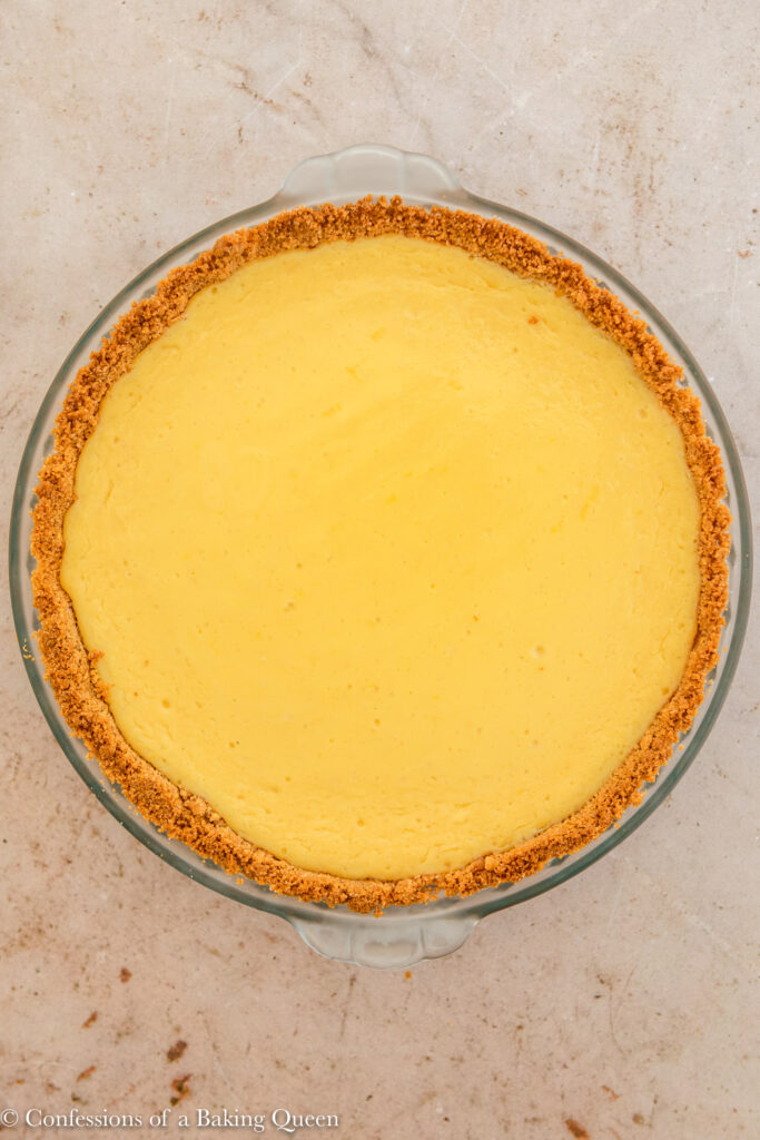 creamy lemon pie just baked on a light brown surface