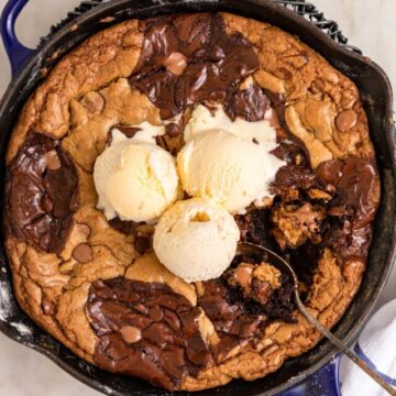 cropped-close-up-of-spoon-taking-a-bite-of-a-skillet-brookie-with-vanilla-ice-cream-1-of-1.jpg