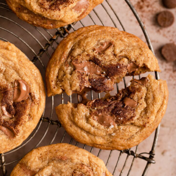 close up of espresso chocolate chunk cookies on a wire rack