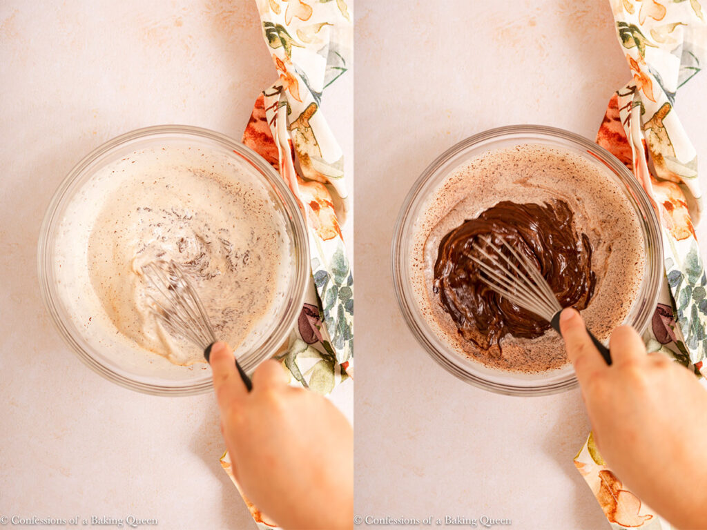 hand holding a whisk whisking chocolate ganache on a light cream surface with a floral linen