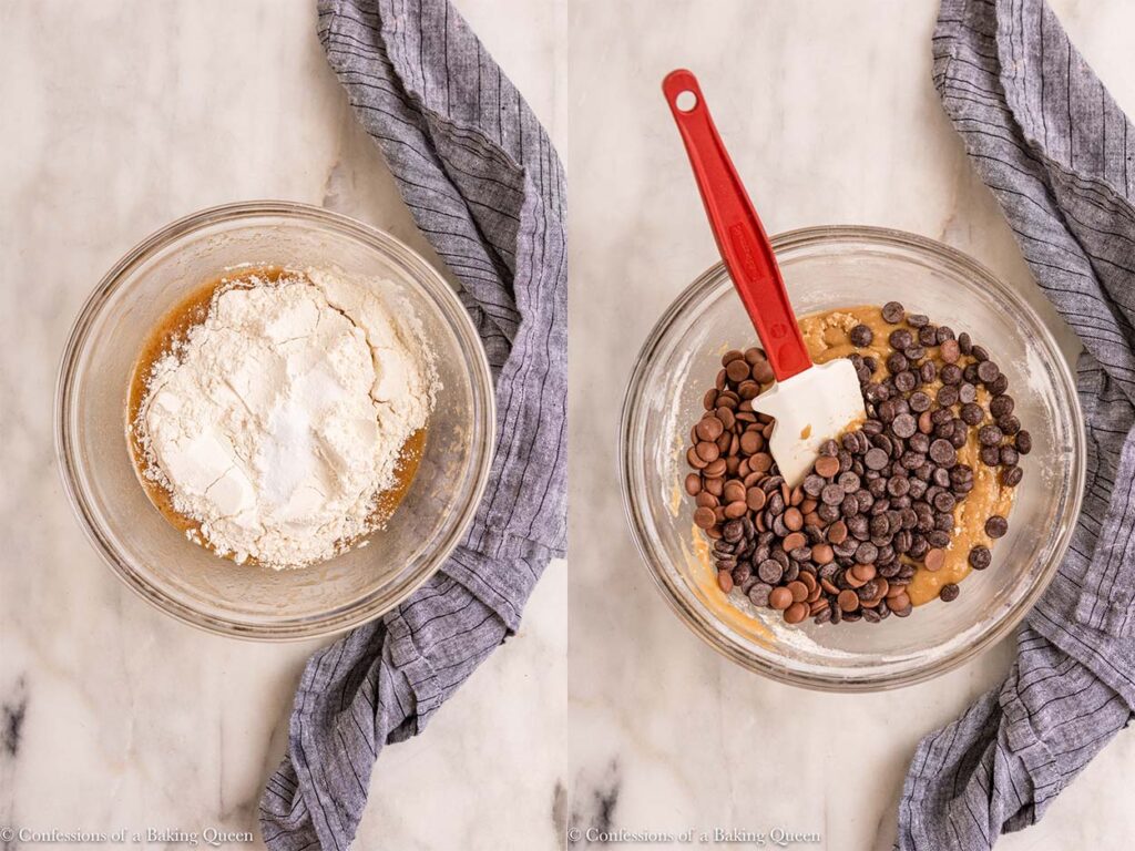dry ingredients added to wet ingredients then chocolate chips added to cookie dough in a glass bowl on top of a blue linen on a white marble surface