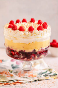 english sherry trifle served in a trifle dish on a floral linen