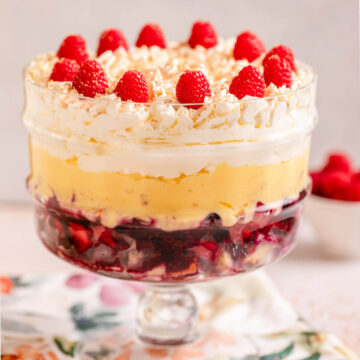 english sherry trifle served in a trifle dish on a floral linen