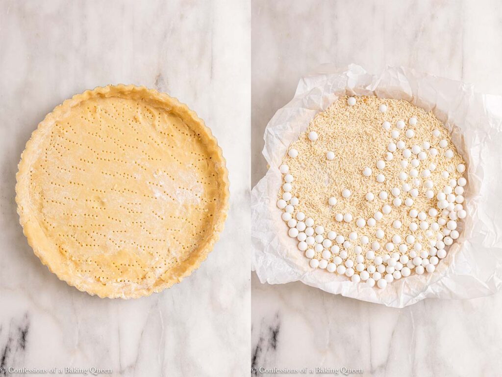 sweet shortcrust pastry pricked and filled with pie weights on a white marble surface