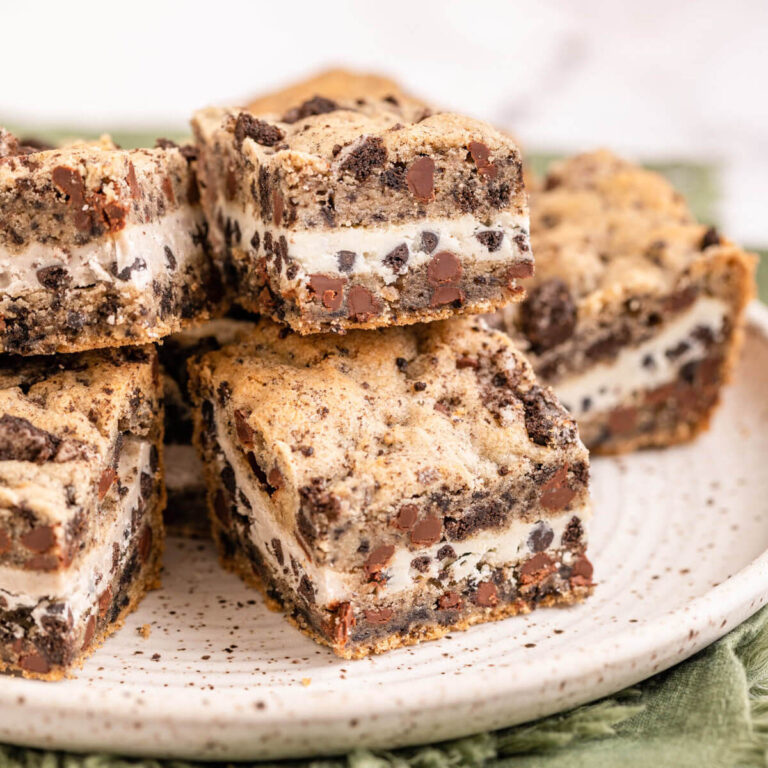 plate of cookies and cream blondies on top of a green linen
