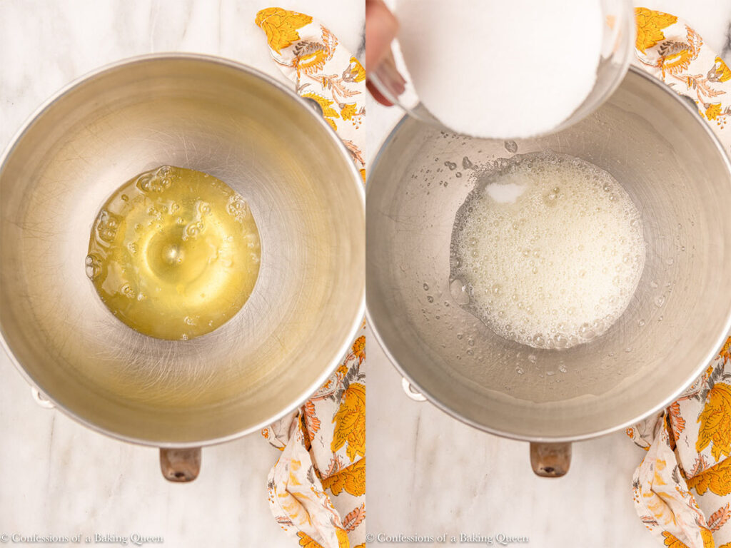 egg whites whisked together with sugar added slowly in a metal mixing bowl on a white marble surface with a floral linen