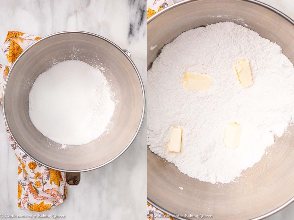 yellow cake dry ingrediens whisked together then chunks of butter added in a metal bowl on a white marble surface with a yellow flowery linen