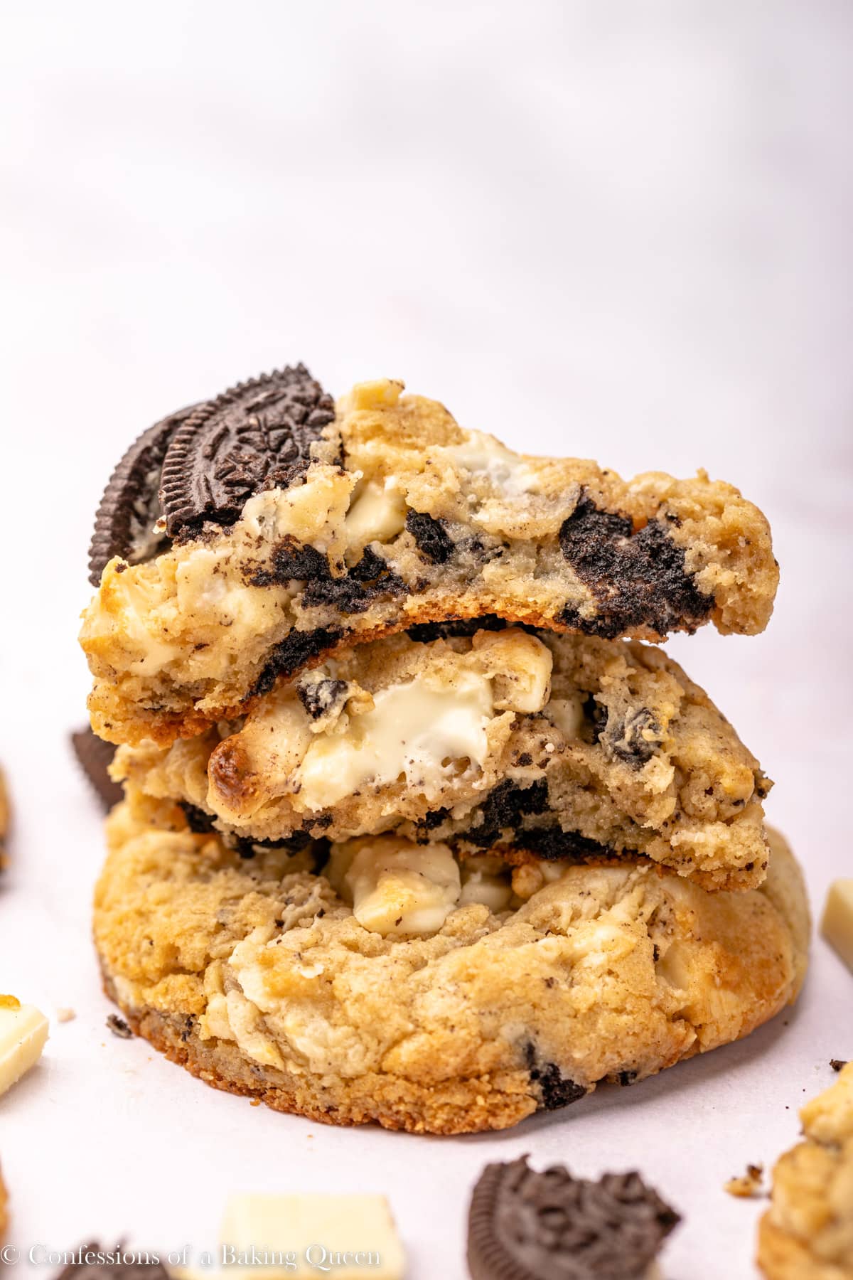 stack of cookies and cream cookies on an light surface