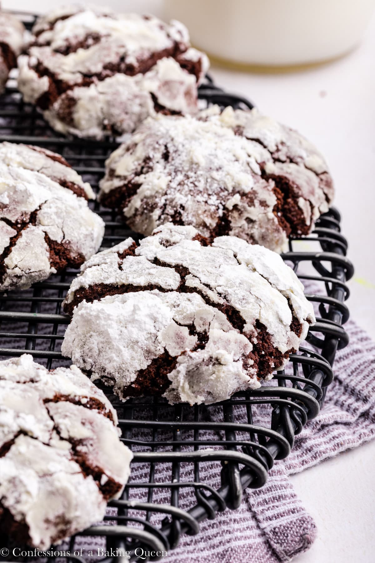 Chocolate Crinkle Cookies cooling on a wire rack.