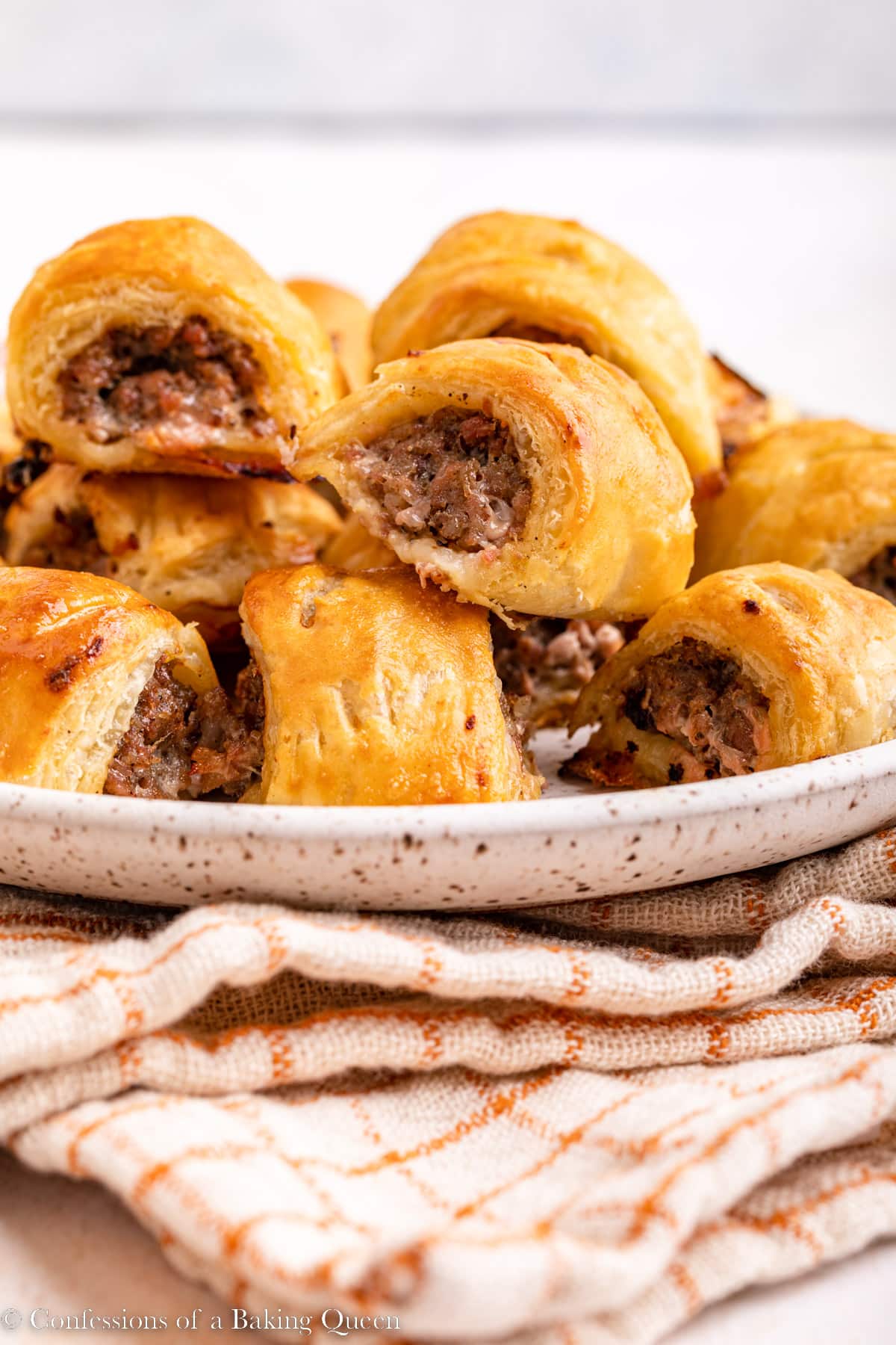 Sausage rolls on a plate.