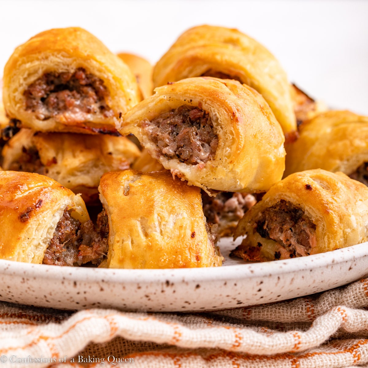 Sausage rolls on a plate.