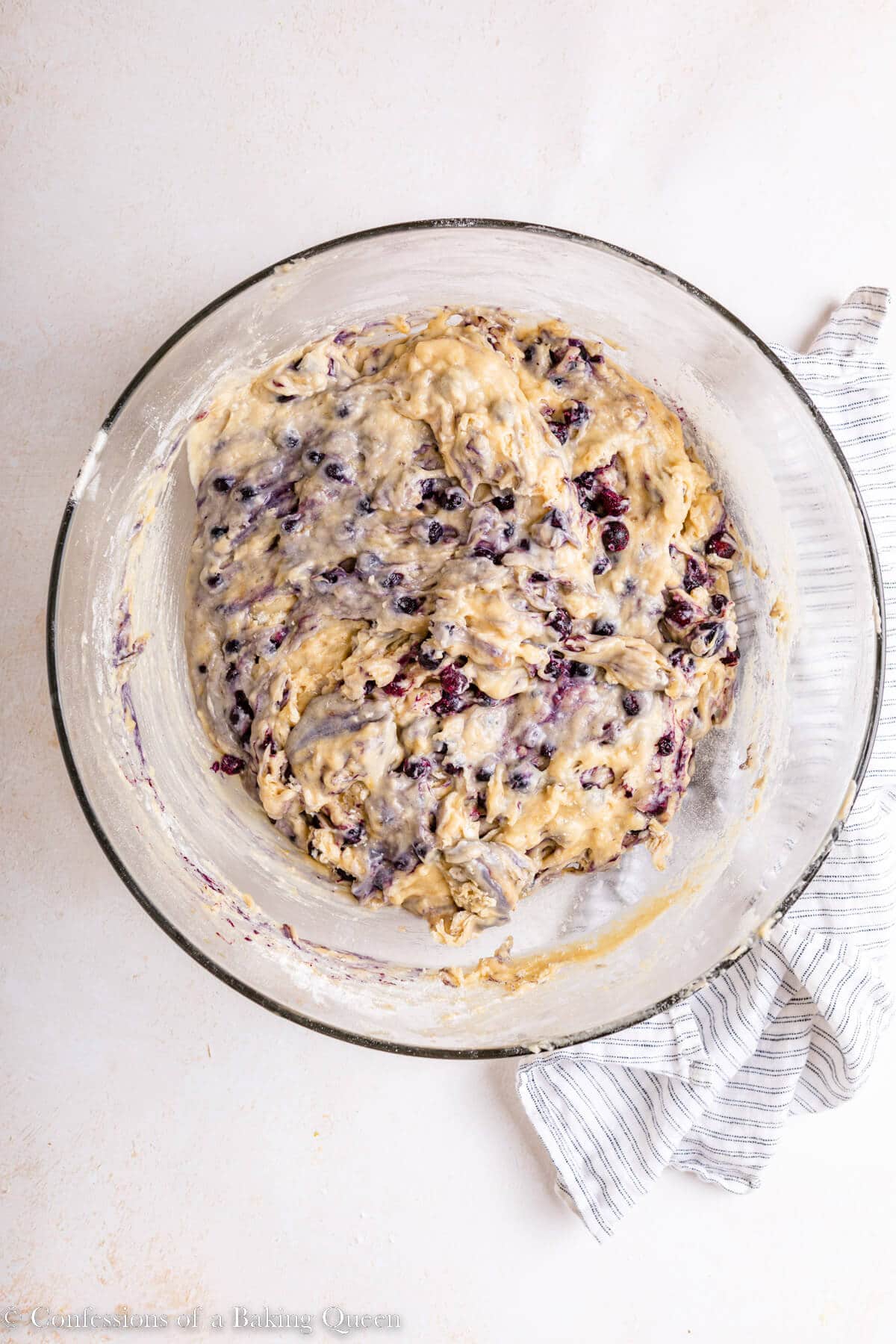 Banana blueberry muffin batter in a mixing bowl.