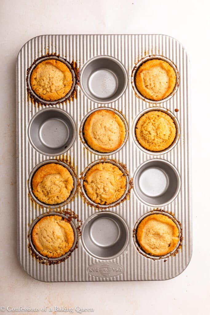 Muffins baked in a muffin pan. Only 8 tins are filled.