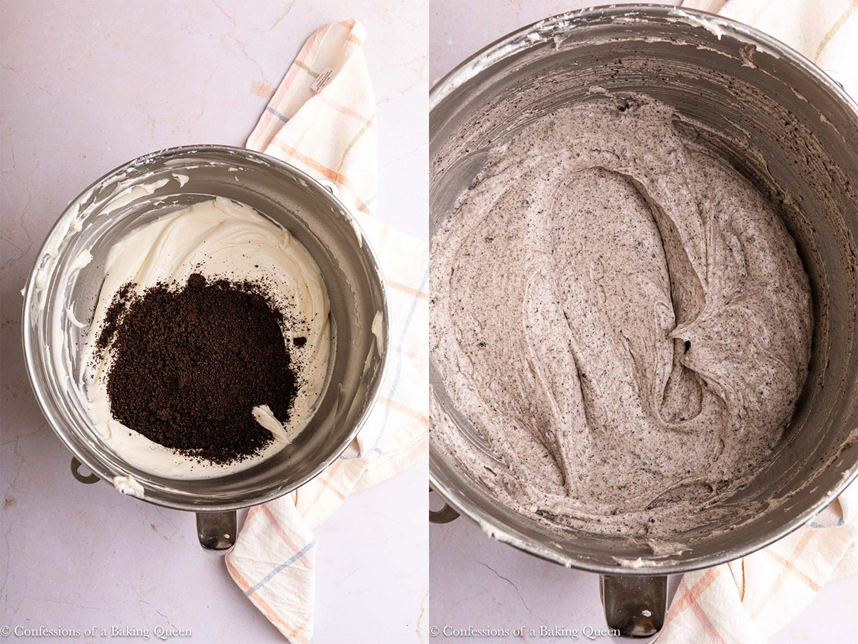 crushed oreos added to cream cheese buttercream in a metal bowl on a light surface with a light multi colored linen