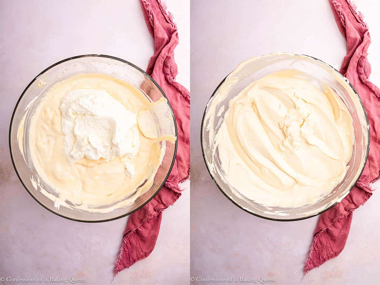 whipped cream added to ice cream mixture then mixed to a cheesecake ice cream base in a large glass bowl on a light pink surface with a pink linen.